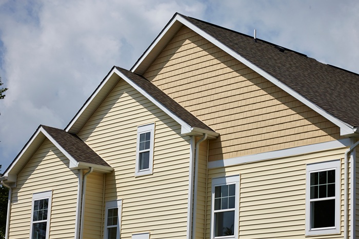 How Can Homeowners Evaluate Siding Materials (Vinyl, Fiber-Cement, Engineered Wood) for Durability and Energy Efficiency in Minnesota’s Climate?